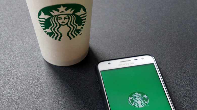 Starbucks drink and logo on cell phone 