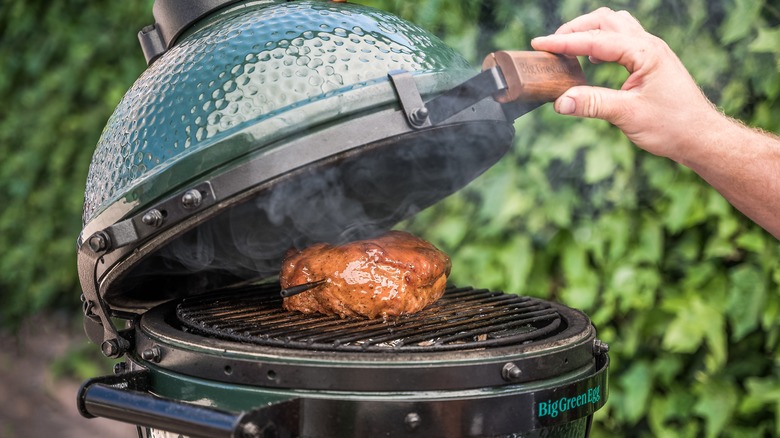 wireless thermometer in meat on grill