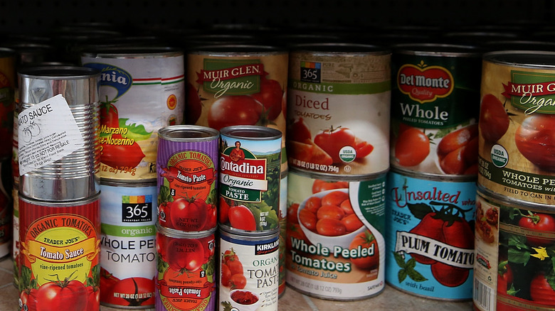 canned tomato products on shelf
