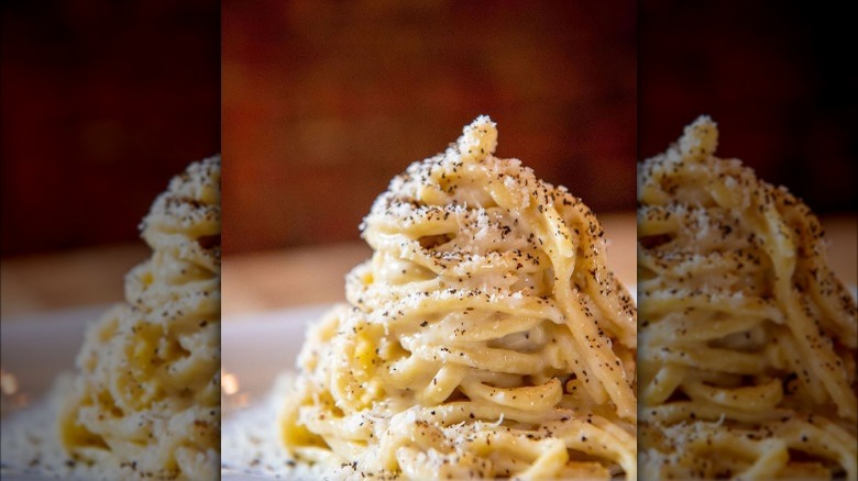 A tall dish of cacio e pepe. 