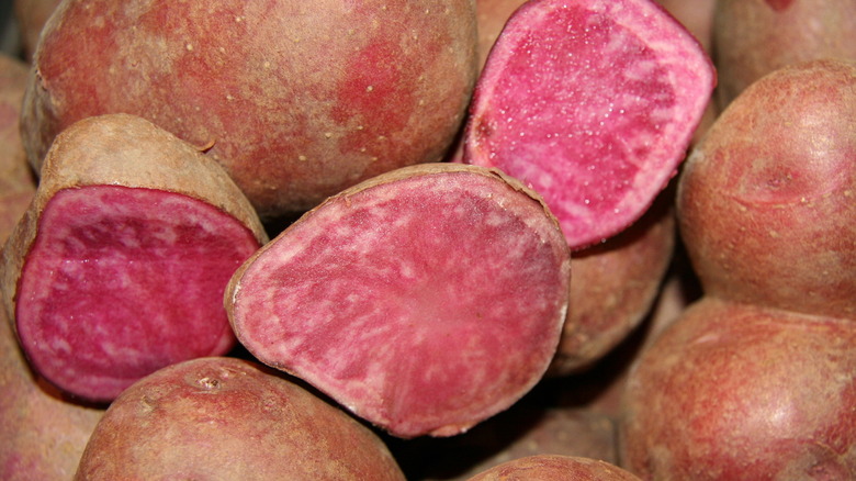 halved and whole pink potatoes