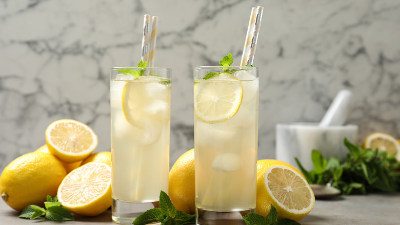 Glasses of lemonade and lemons