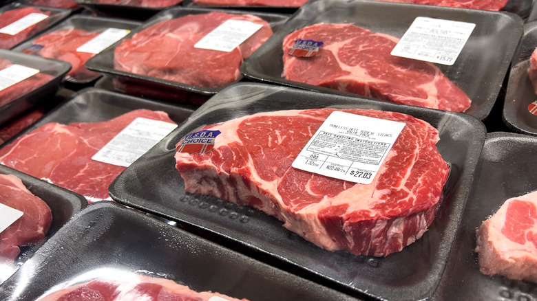 Packaged steaks on display in a supermarket