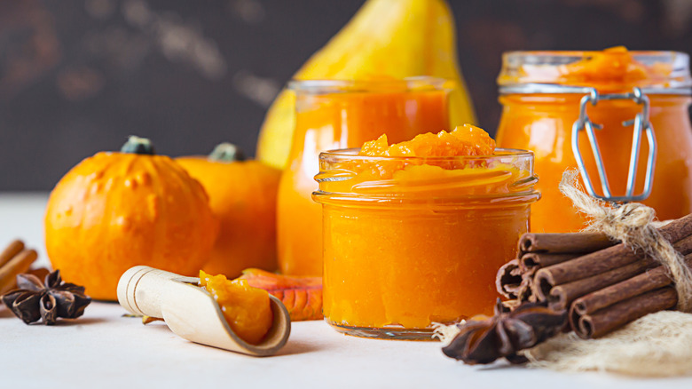 Puréed pumpkin in jars with seasonings