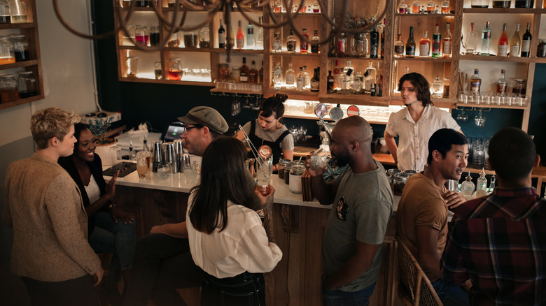 People talking at a bar