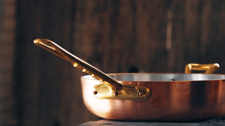 copper saucepan on table