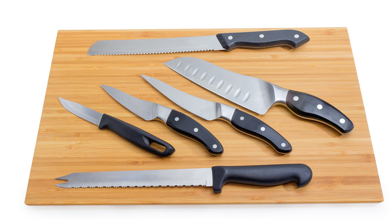 Set of knives on cutting board