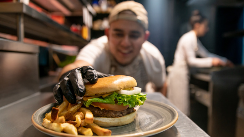 chef putting together a burger