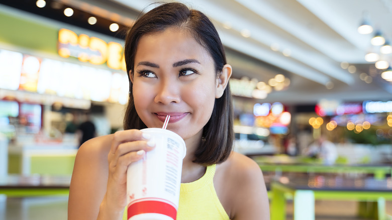 woman drinking soda