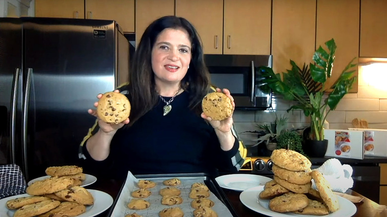 alex guarnaschelli holding up two cookies