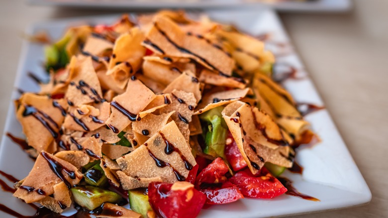 Khubz piled onto a salad