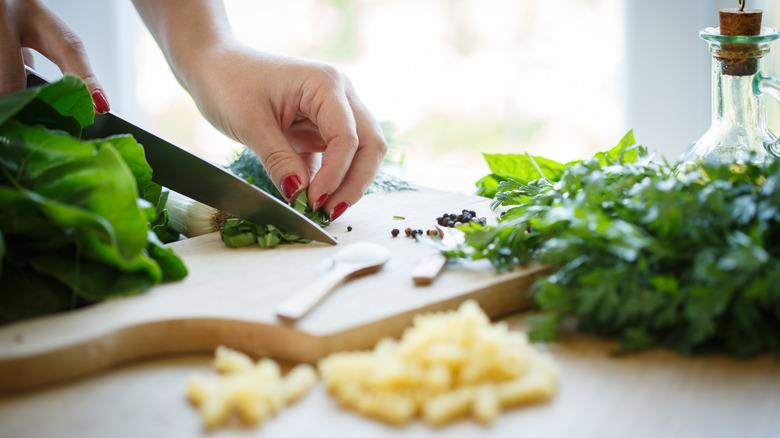 Person chopping herbs 