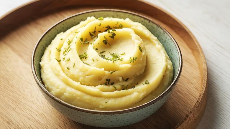 An overhead view shows a bowl of mashed potatoes.