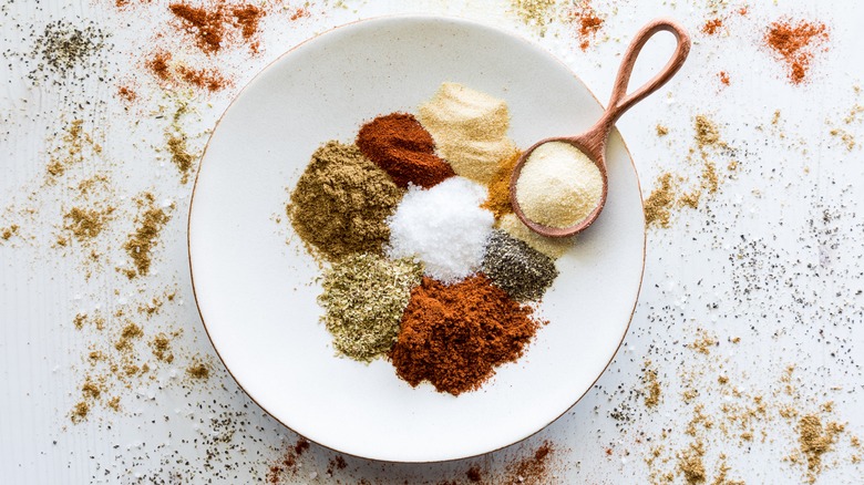 A plate with seasonings for taco meat