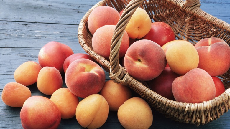 Peaches spilling out of basket