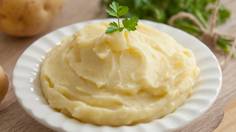 Mashed potatoes in a bowl with parsley