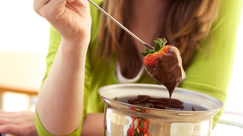 Strawberry dipped in chocolate fondue