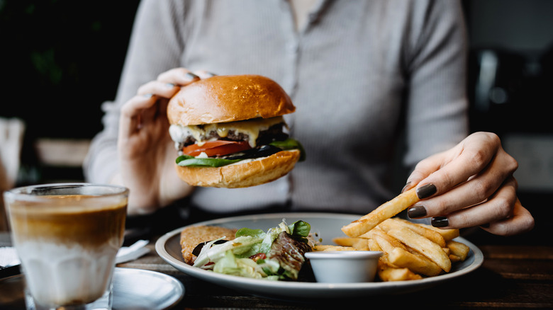 eating a burger and fries