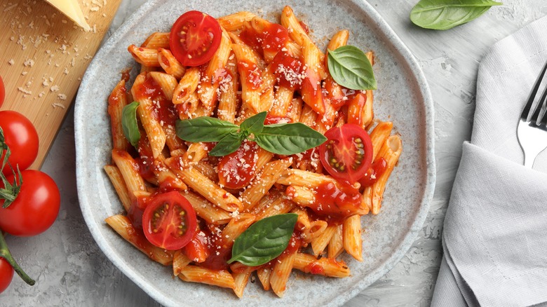 Penne with tomato sauce and herbs