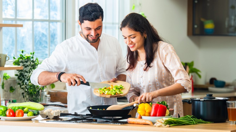 A couple cooking together