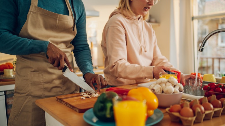 multicultural couple cooking