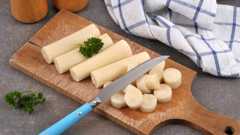 Palm hearts on cutting board