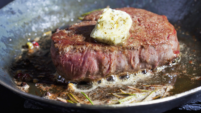 Compound butter melting on steak