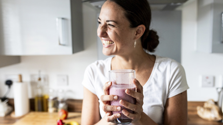 woman drinking smoothie