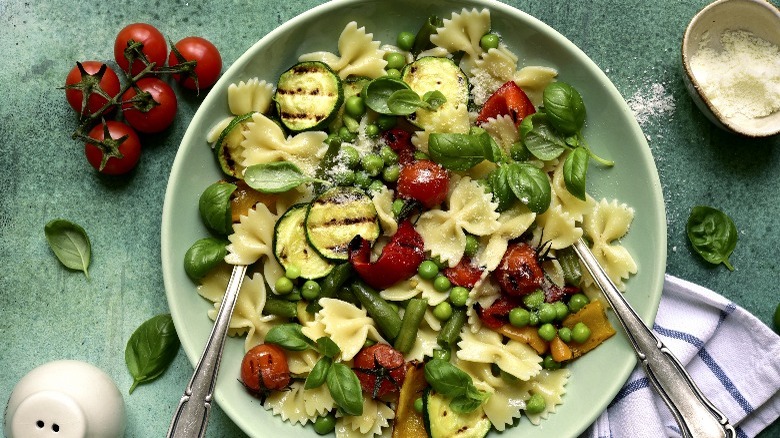 Pasta primavera in green bowl