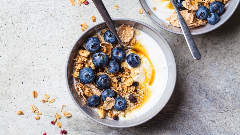 bowls of granola and milk