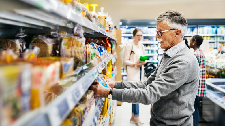 man shopping for bread