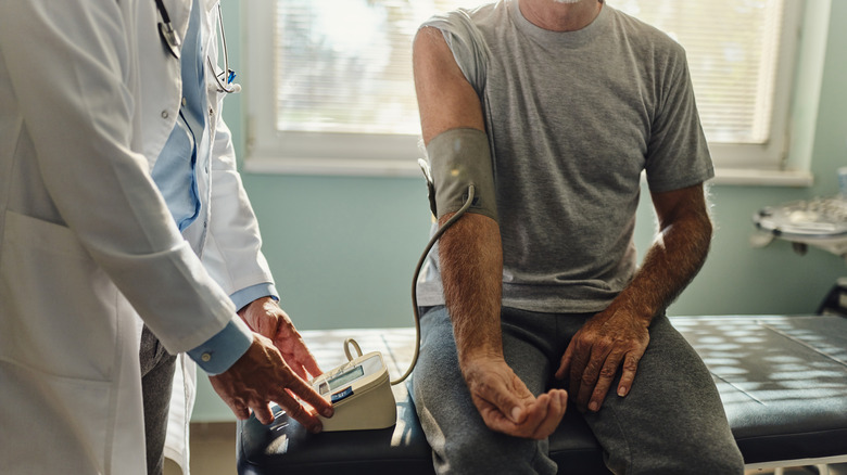 Doctor measuring blood pressure