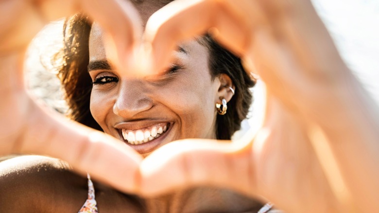 Woman making heart with hands