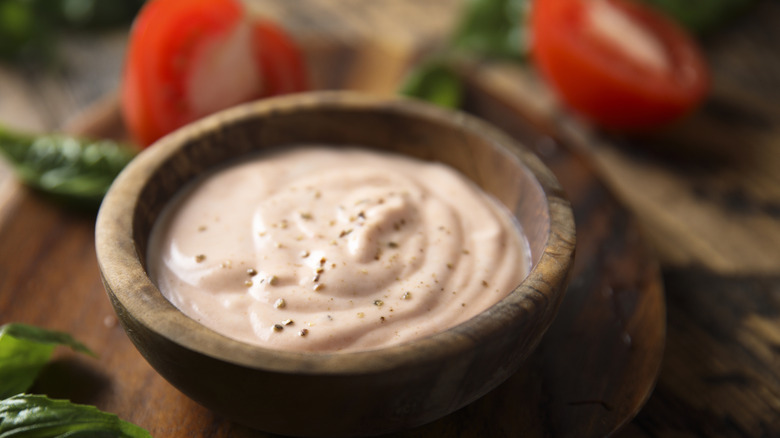 Russian or Thousand Island dressing in wooden bowl