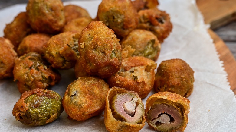 baked breaded olives on parchment