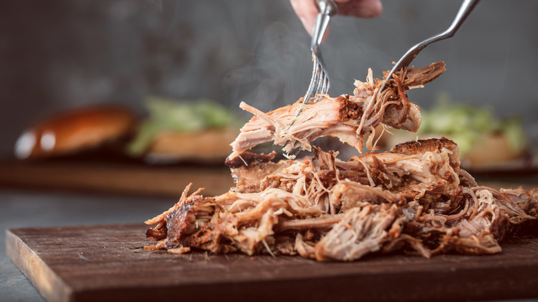 pulled pork on cutting board