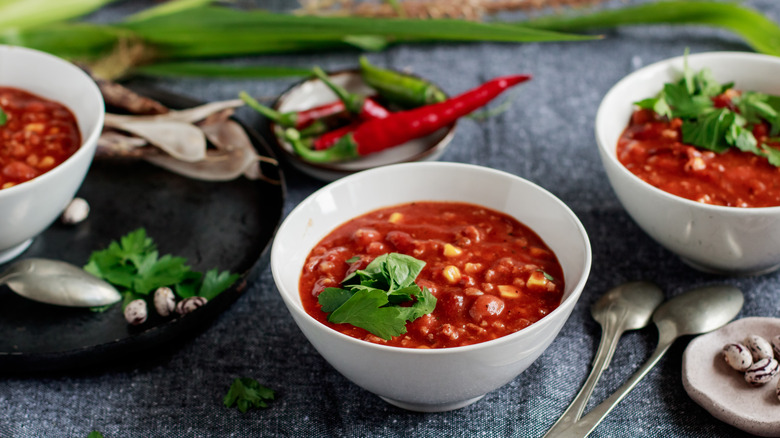 bowls of chili and peppers