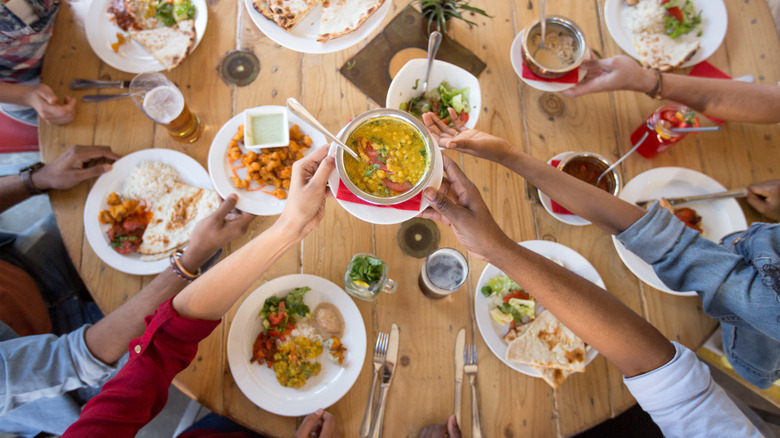 Group of friends eating curry