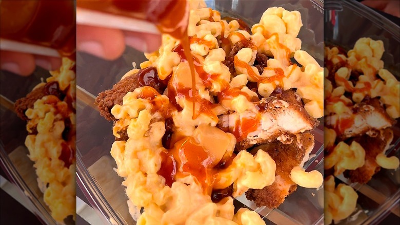 Mac and cheese, nuggets, fries, and buffalo sauce in a bowl