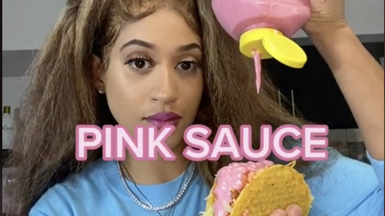Veronica Shaw squeezing pink sauce