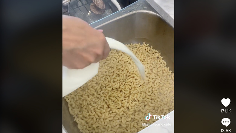 Milk being poured on macaroni