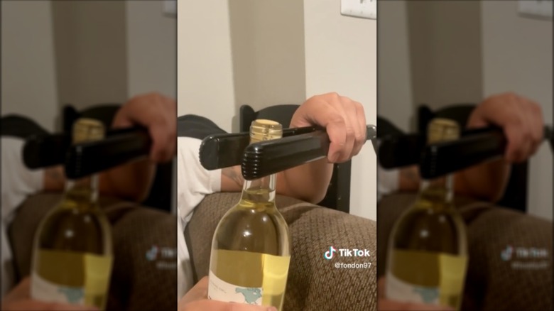 opening wine with hair straightener