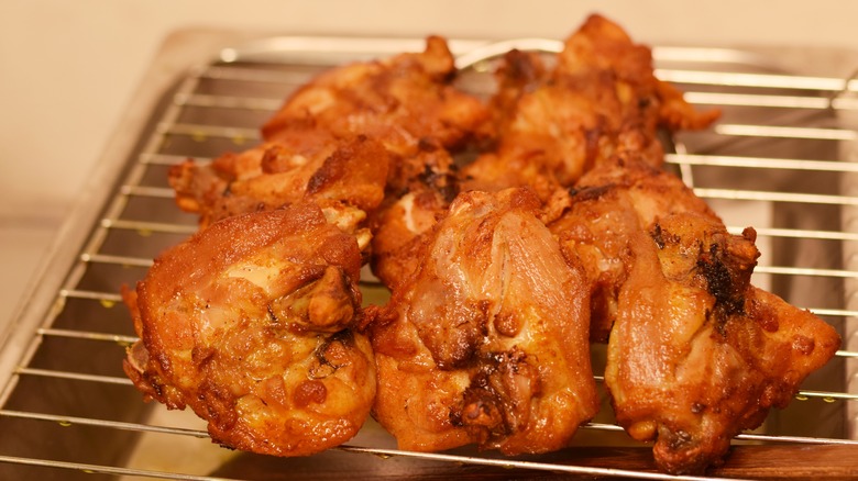 Chicken draining on wire rack