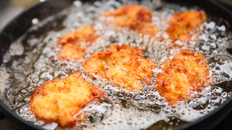 Chicken frying in oil