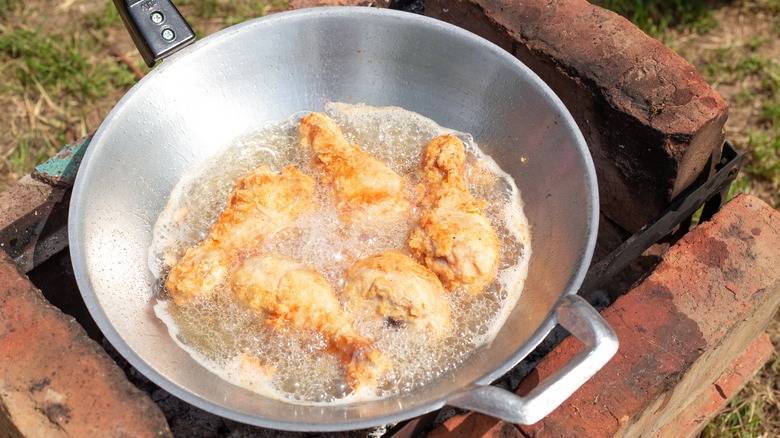 frying chicken in wok