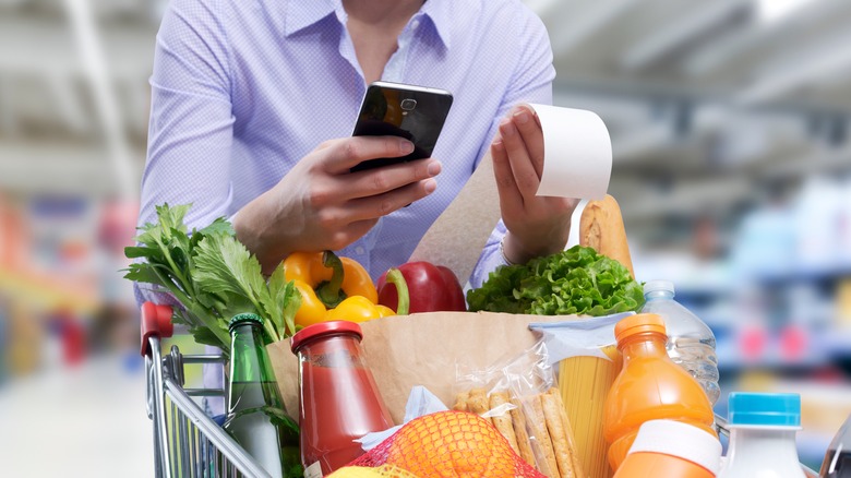 groceries with receipt and phone