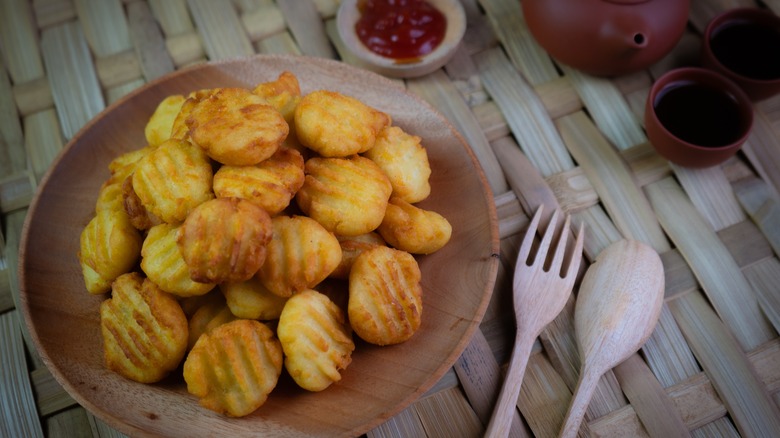 Potato pillows on wooden plate