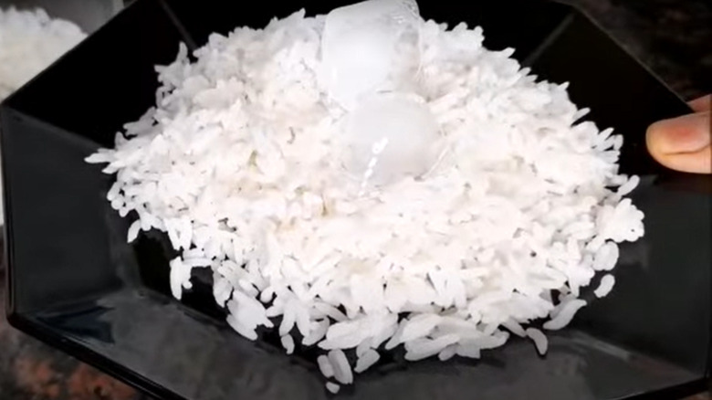 Ice cube on pile of rice