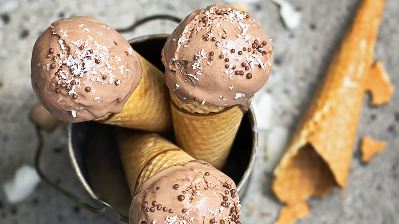 chocolate ice cream in cones with toppings