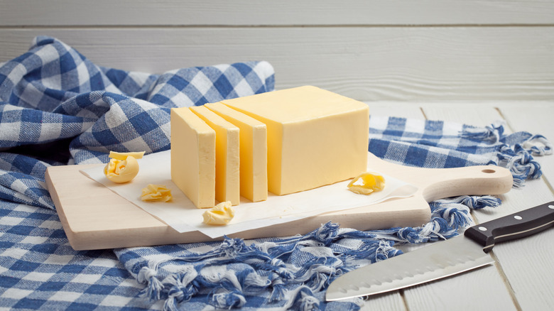 Butter sliced on cutting board